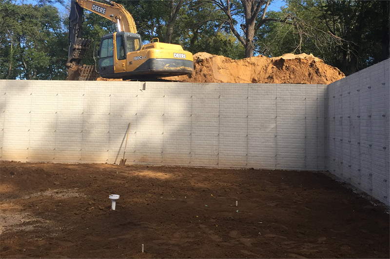 Basement floor preparation with radon system components in Portage Michigan